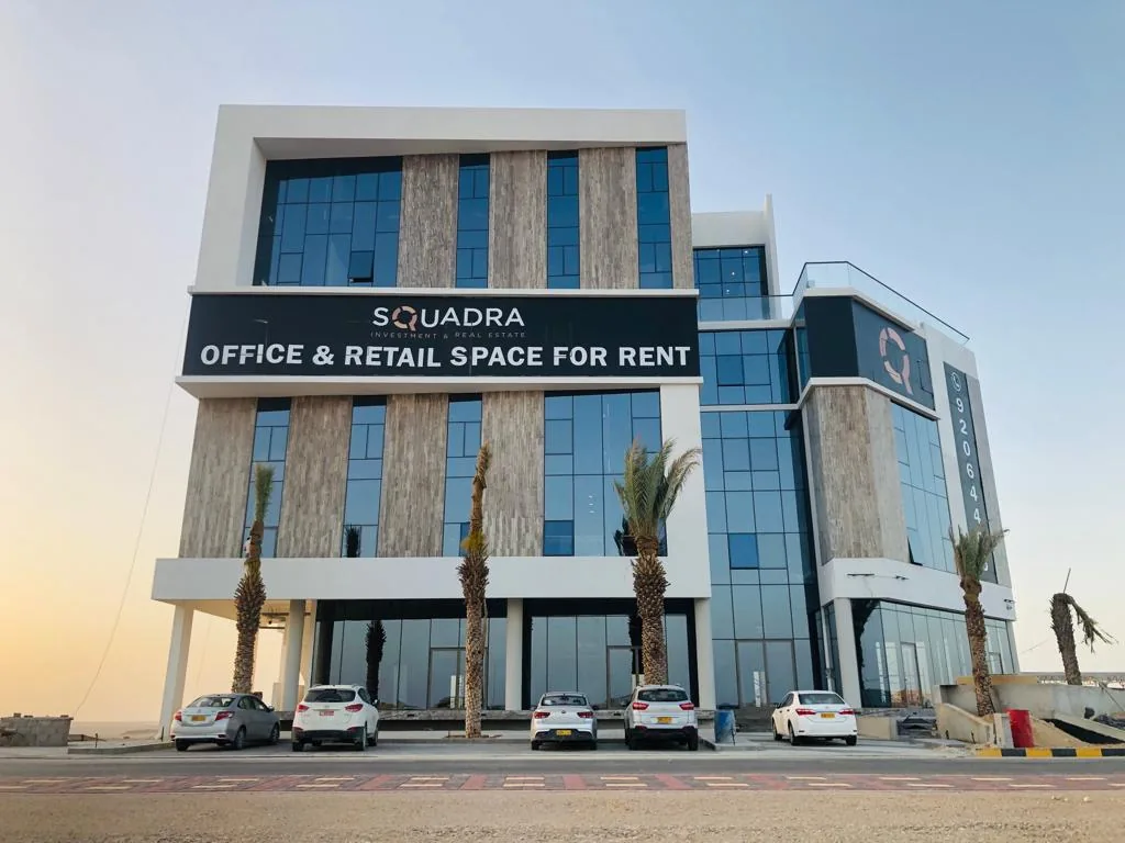 Squadra building — completed façade by day